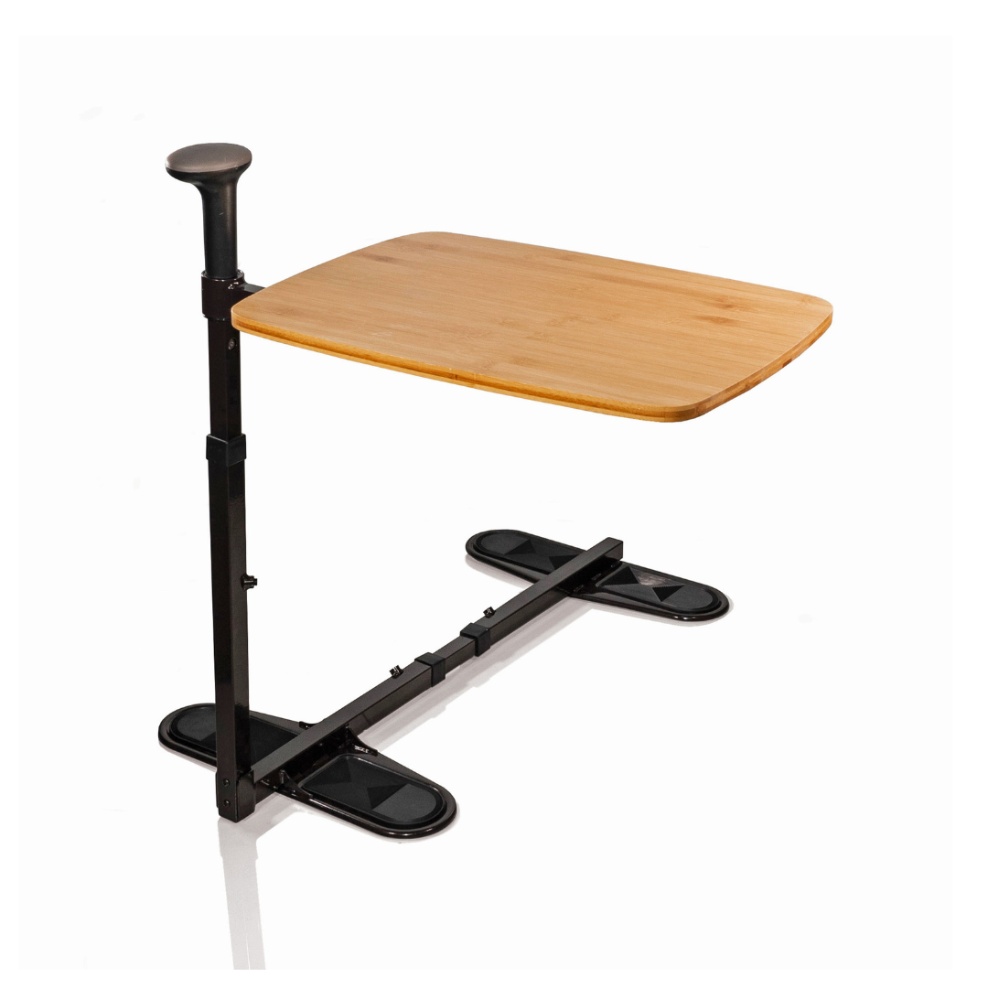 The Stander Omni Tray is a height-adjustable overbed table with a wooden surface and black metal frame, featuring a sturdy base that slides under furniture—perfect as a swivel tray table and standing aid for extra convenience and support.